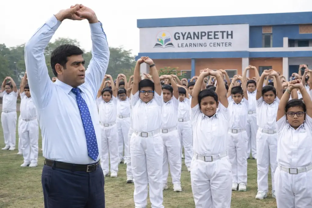 Director of gyanpeeth conducting exercise to students